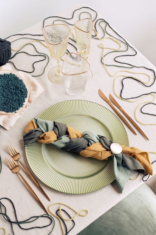 Soft green table setting with embroidery hoops