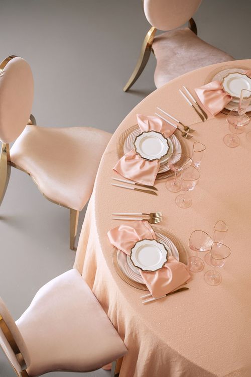 Soft pink table setting at round table