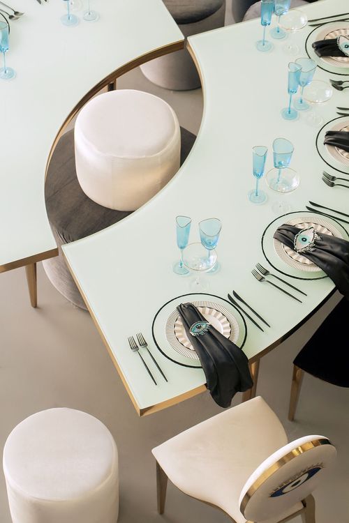 Eye-shaped table and black-and-white set