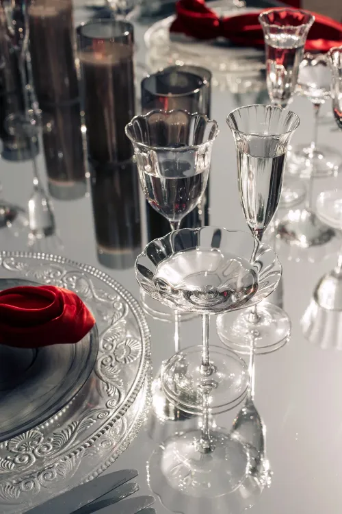 Translucent set with red accents on a white rectangular table