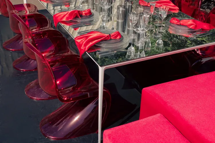 Translucent set with red accents on a white rectangular table