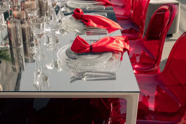 Translucent set with red accents on a white rectangular table