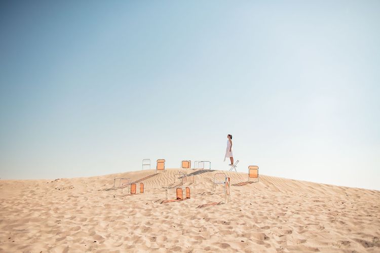 Transparent folding chairs desert