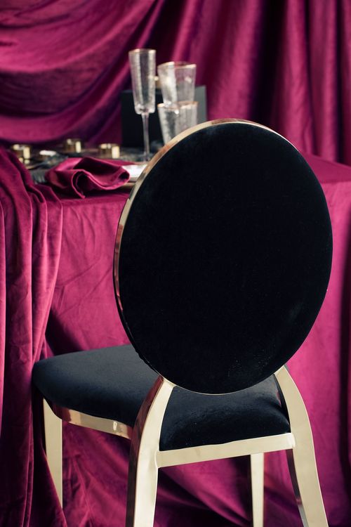 Velvet-Draped Dining — Gold Candles, Burgundy Noir
