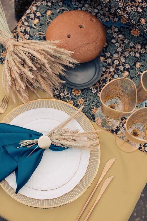 Wheat table setting with blue accent