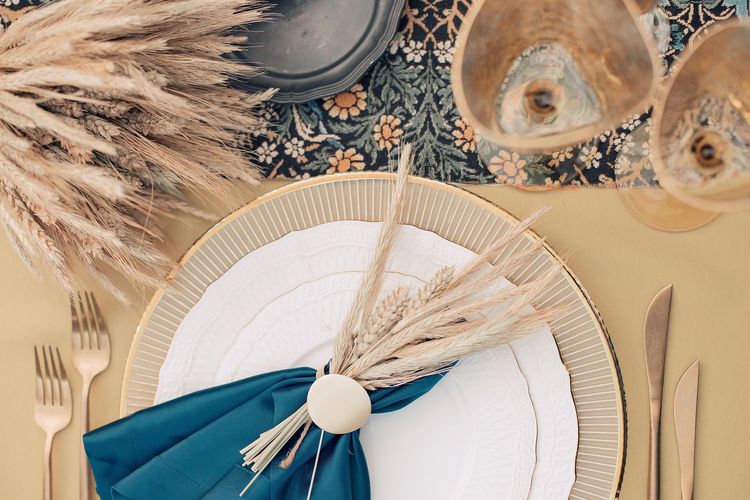Wheat table setting with blue accent