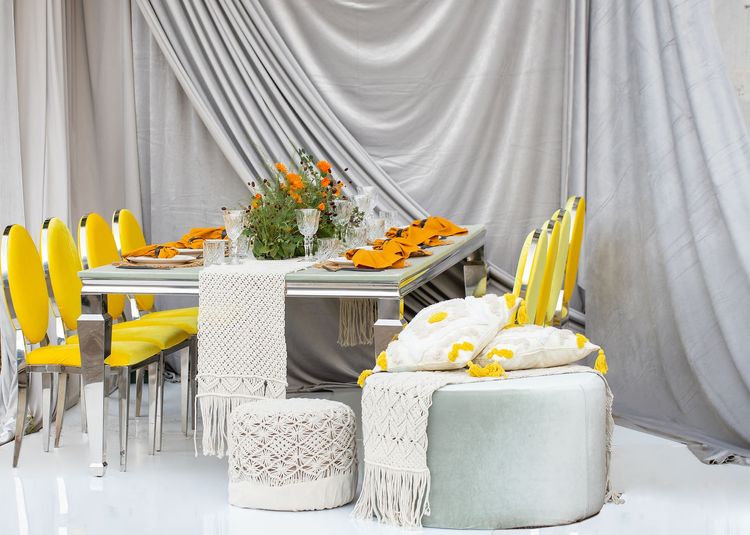 Yellow-orange table setting at rectangular table
