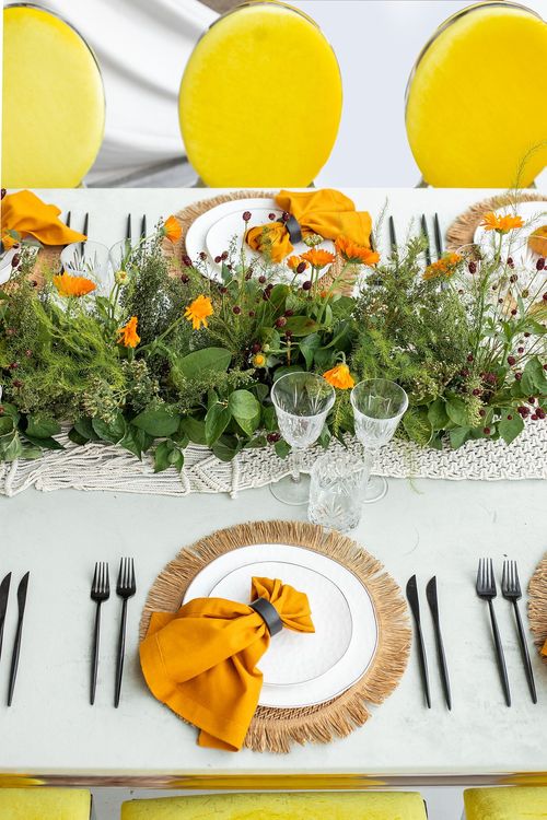 Yellow-orange table setting at rectangular table