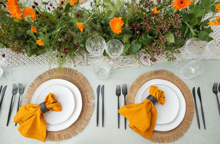 Yellow-orange table setting at rectangular table