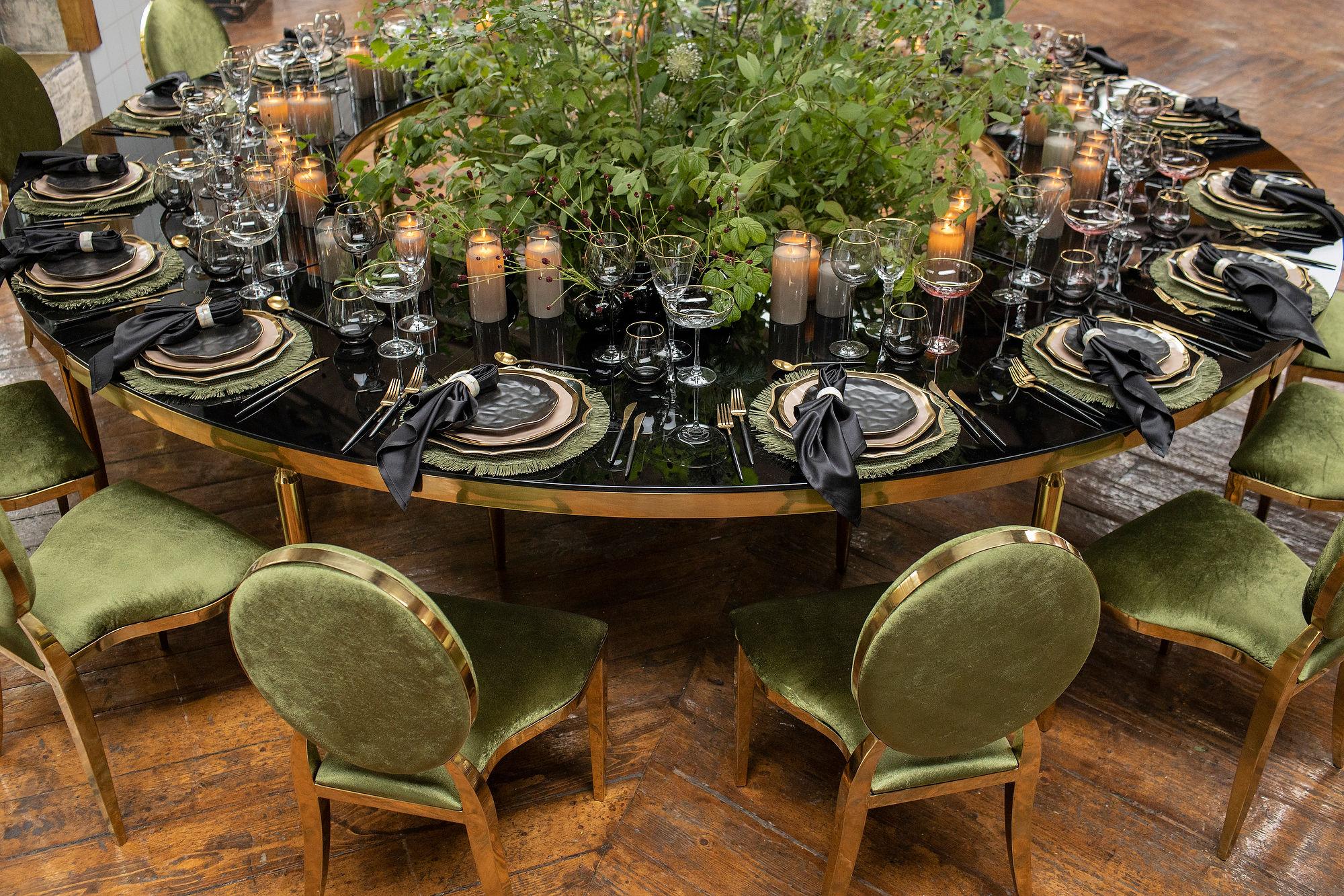 Green serving at serpentine table