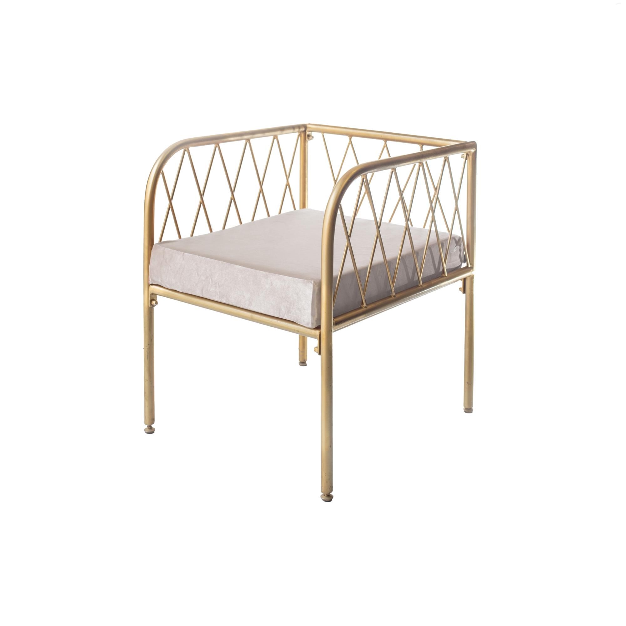 Lounge bench with gold metal frame and velvet cushion(s), visually light centerpiece setup (rental, Dubai).