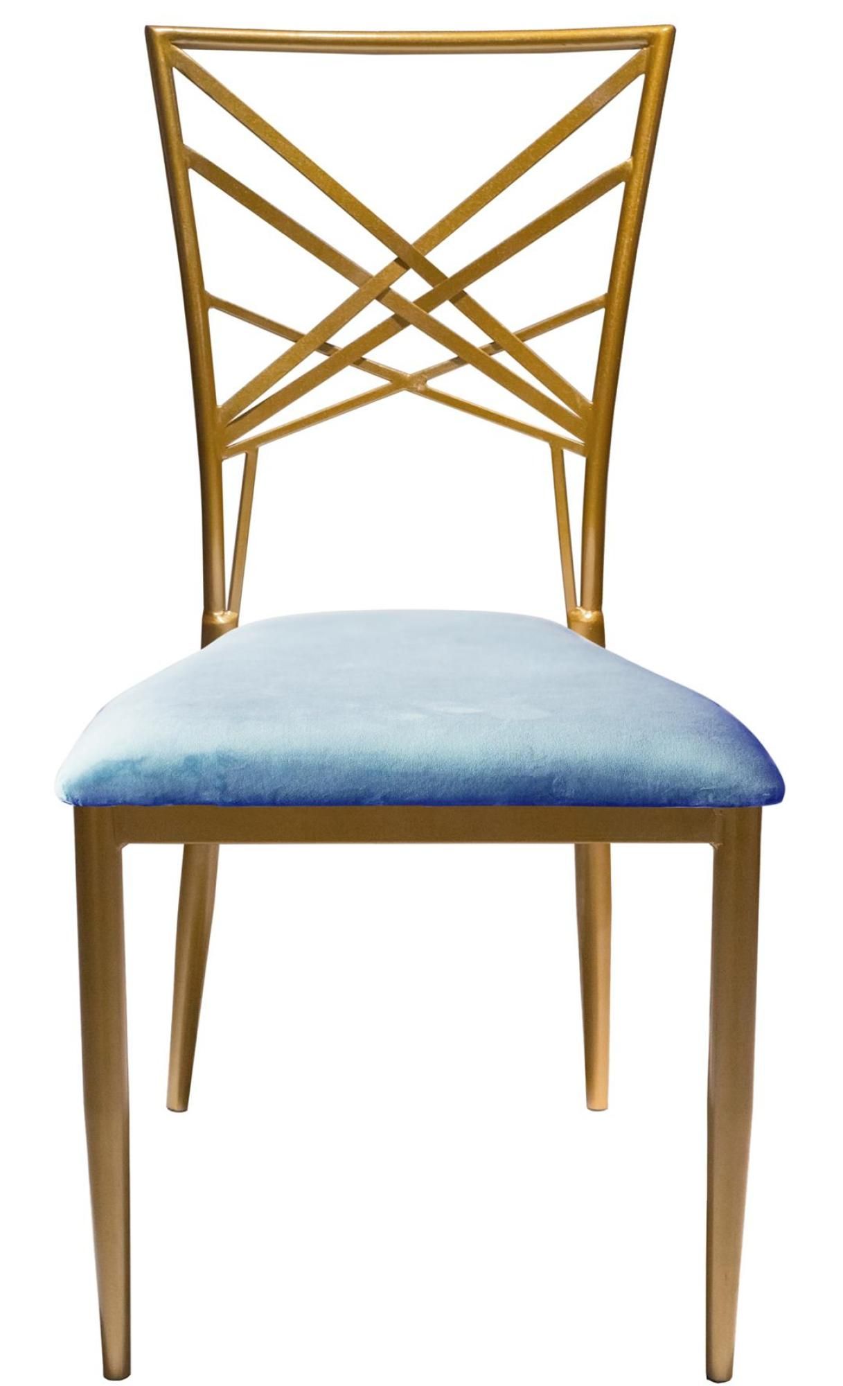 Golden lattice-back chair with a light velvet seat in a sunlit event space; modern dining setup with soft neutral décor.