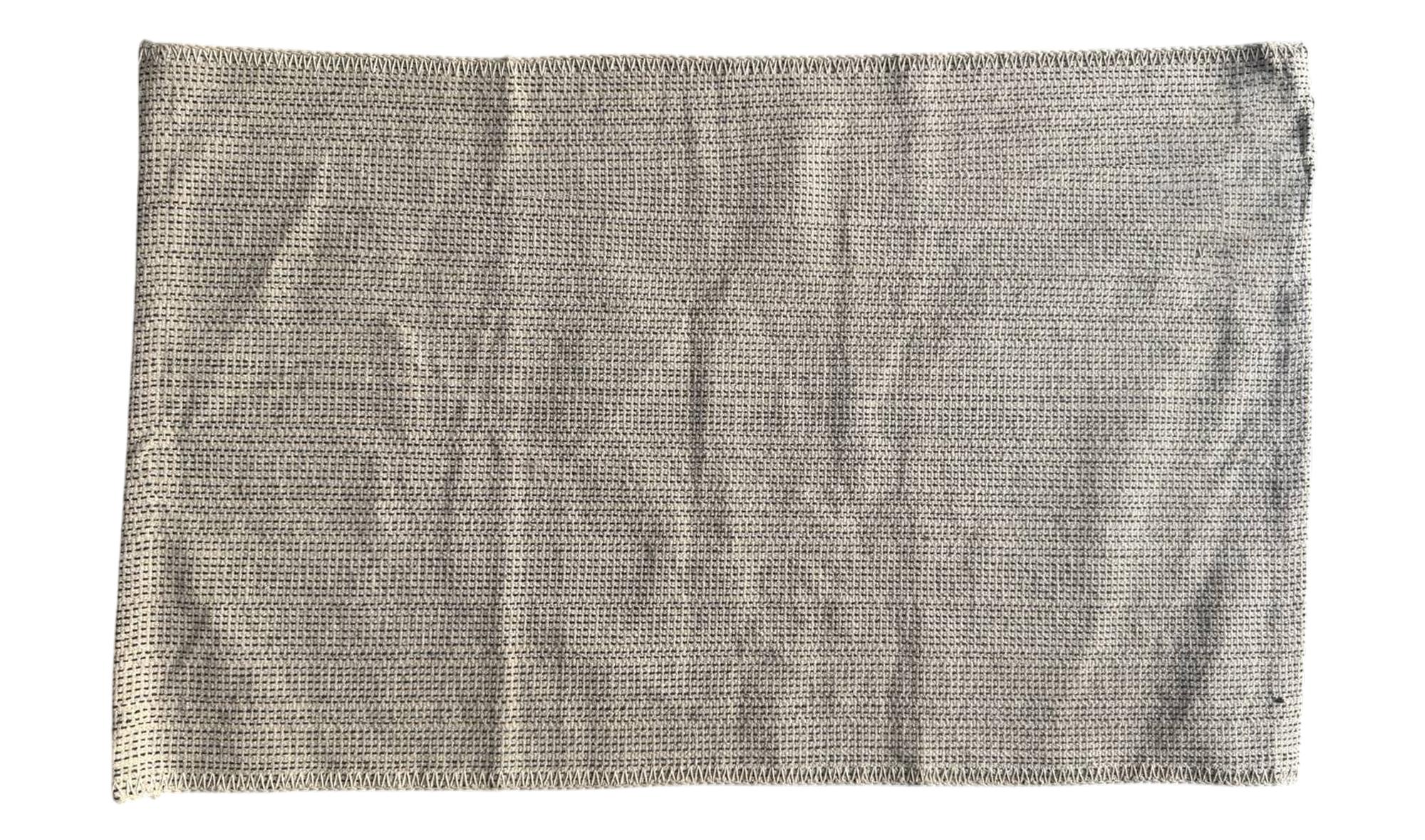 JETE boho rug — soft woven beige surface, handmade from natural fibers for event decor.