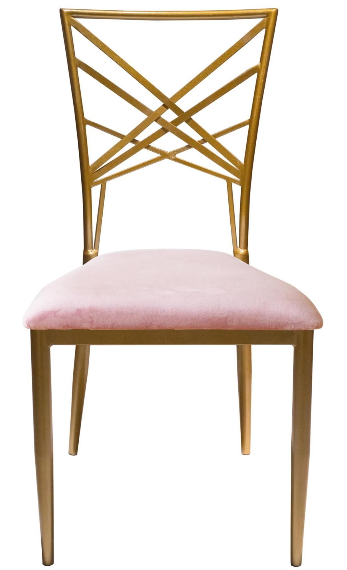 Gold lattice-back chair with a blush pink velvet seat placed at an elegant table with soft pastel décor and natural daylight.