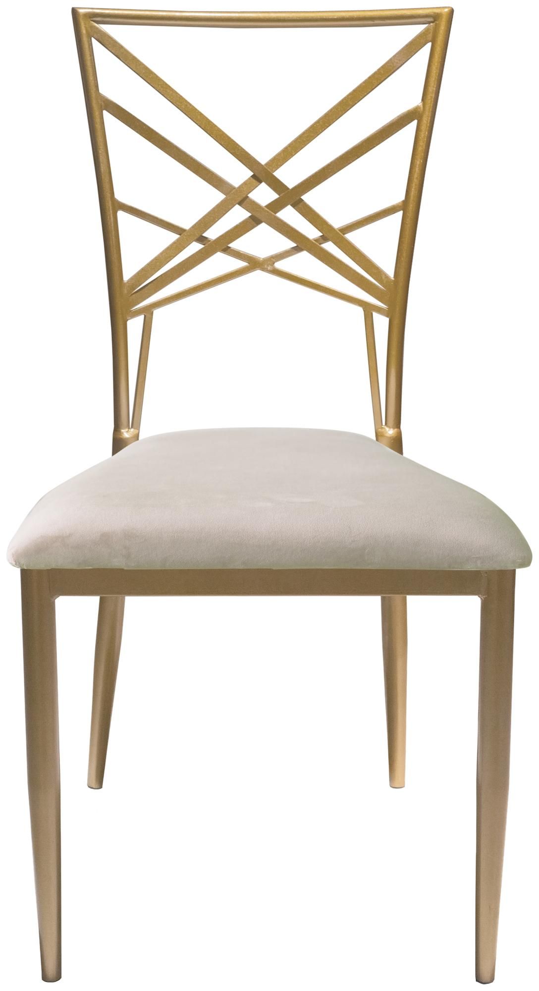 Gold lattice-back chair with a beige velvet seat styled in a warm-toned dining setup with elegant tableware and soft lighting.